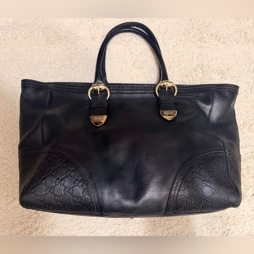 Authentic Gucci large leather tote with Guccissima embossed details.